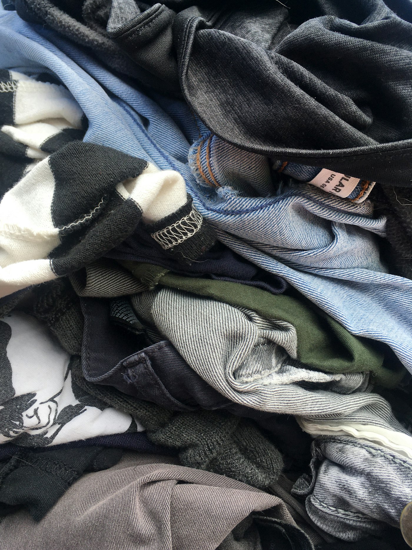 Pile of blue denim jeans