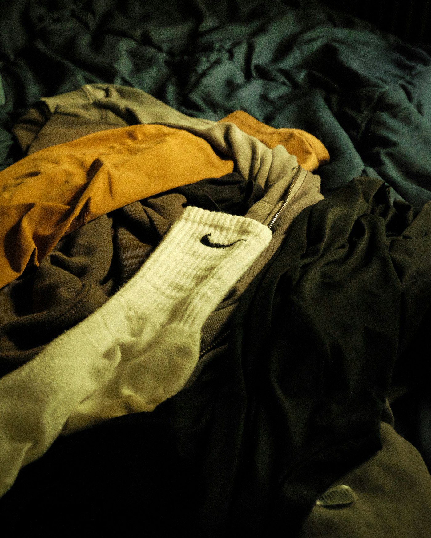 Pile of clothes on a bed