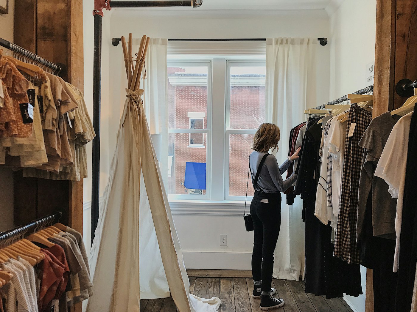Woman selecting clothes from a rack
