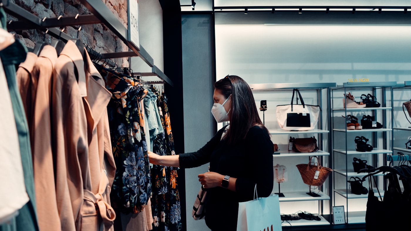 Woman browsing a clothes rack