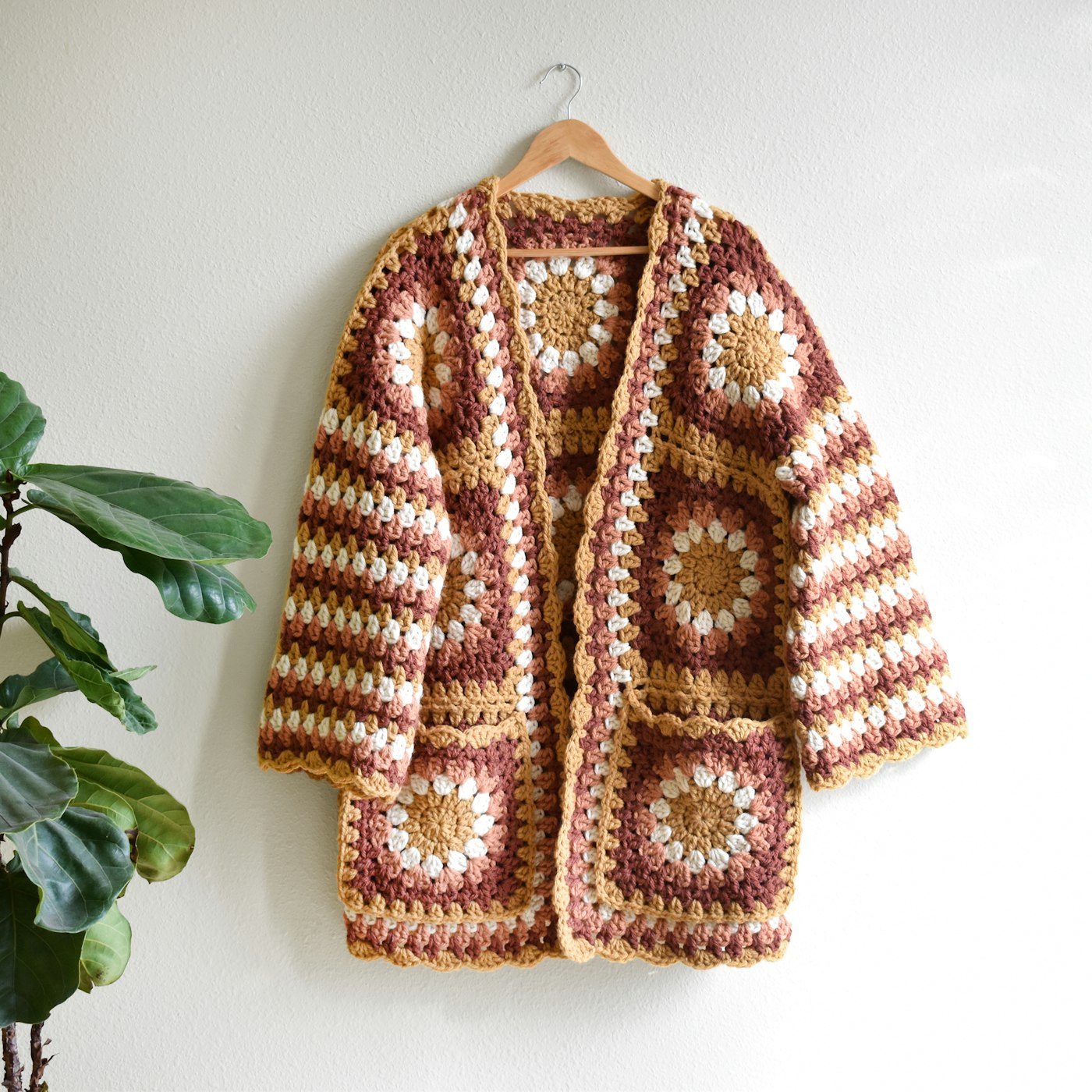 Styled flat-lay of a crocheted jacket