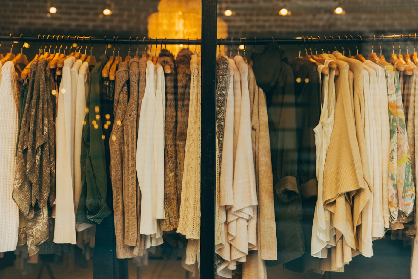 Colourful assorted clothes on hangers
